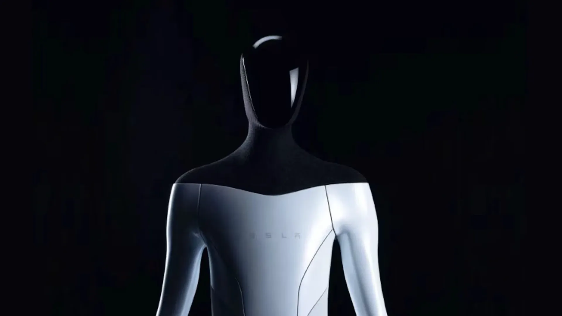 A white and silver humanoid robot photographed from the waist up against black, its head featureless and dark, with a faint wordmark barely visible across the smooth chest panel.