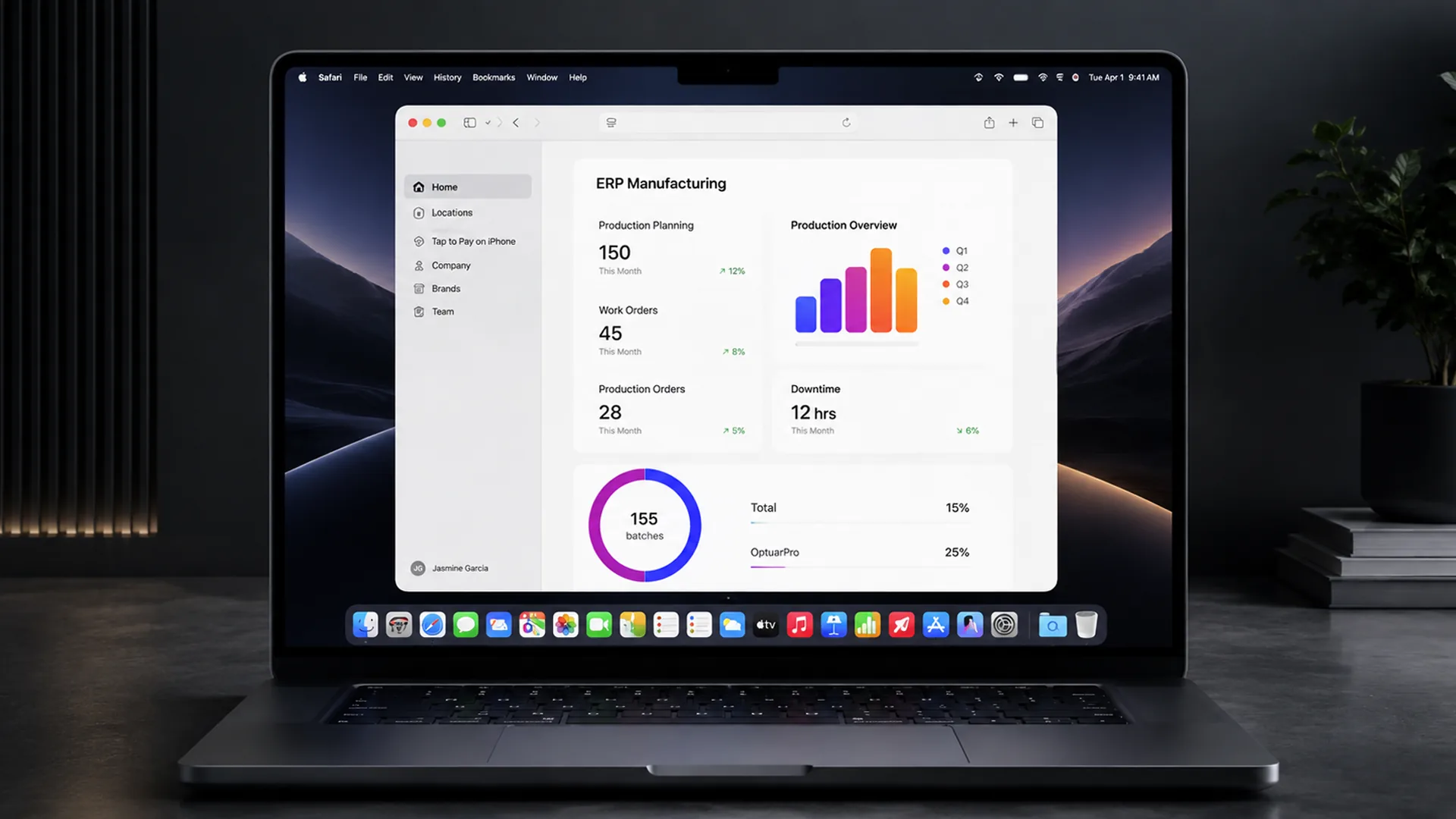 A laptop on a dark desk shows a browser dashboard titled "ERP Manufacturing" with tiles reading "Production Planning 150", "Work Orders 45", "Downtime 12 hrs", a bar chart, and a donut reading "155 batches".
