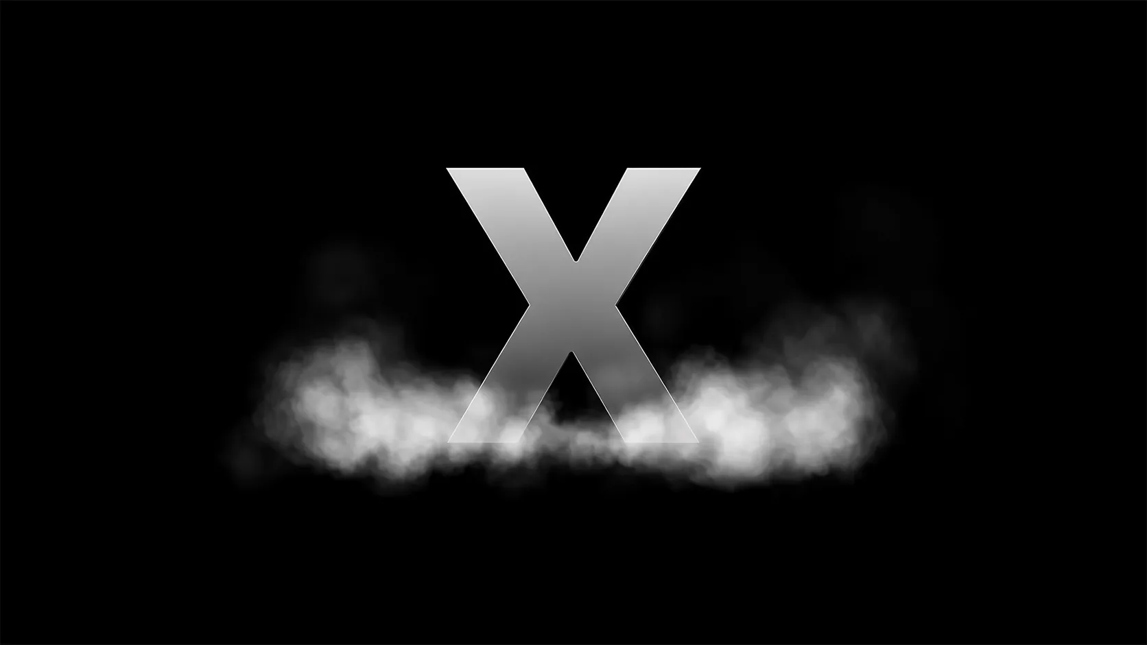 A large silver letter "X" standing against a black background, with a low bank of soft white fog drifting across its base.