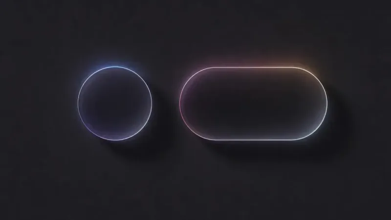 A thin glowing circle outline and a glowing pill-shaped outline side by side on a near-black ground, their rims tinted blue, pink and orange.